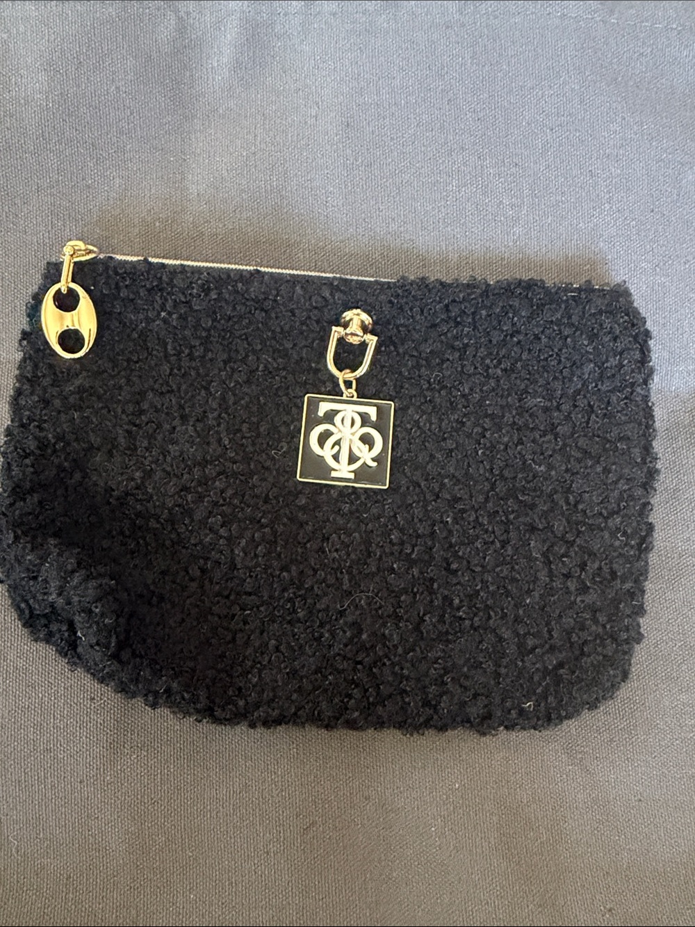 Black Sherpa Zip Pouch with Gold Emblem